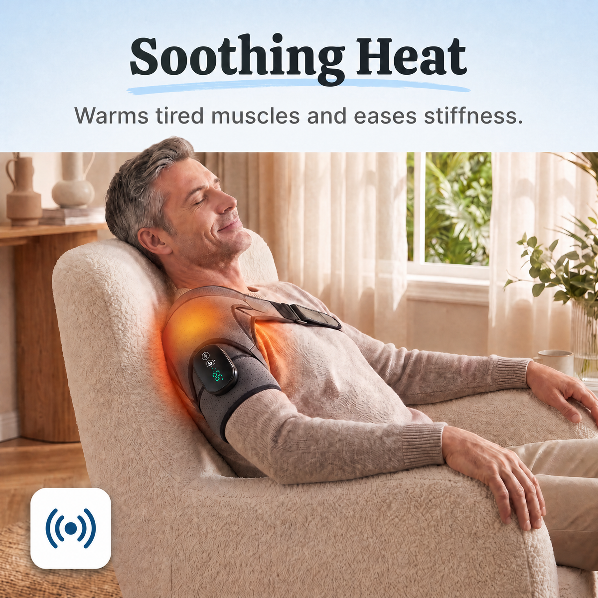 Soothing heat: man relaxing with the shoulder massager